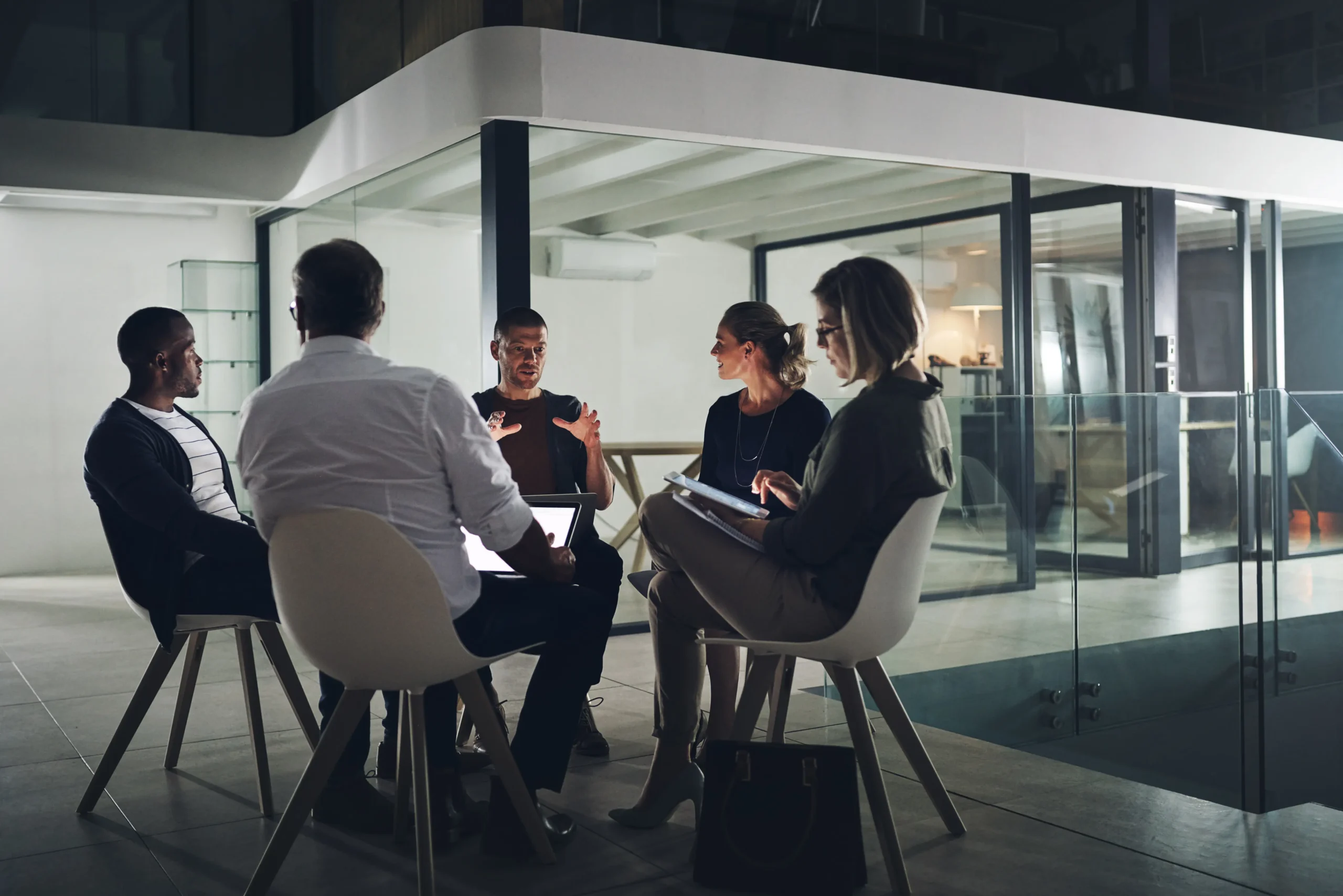 Consulting team discussing ERP implementation strategy in office